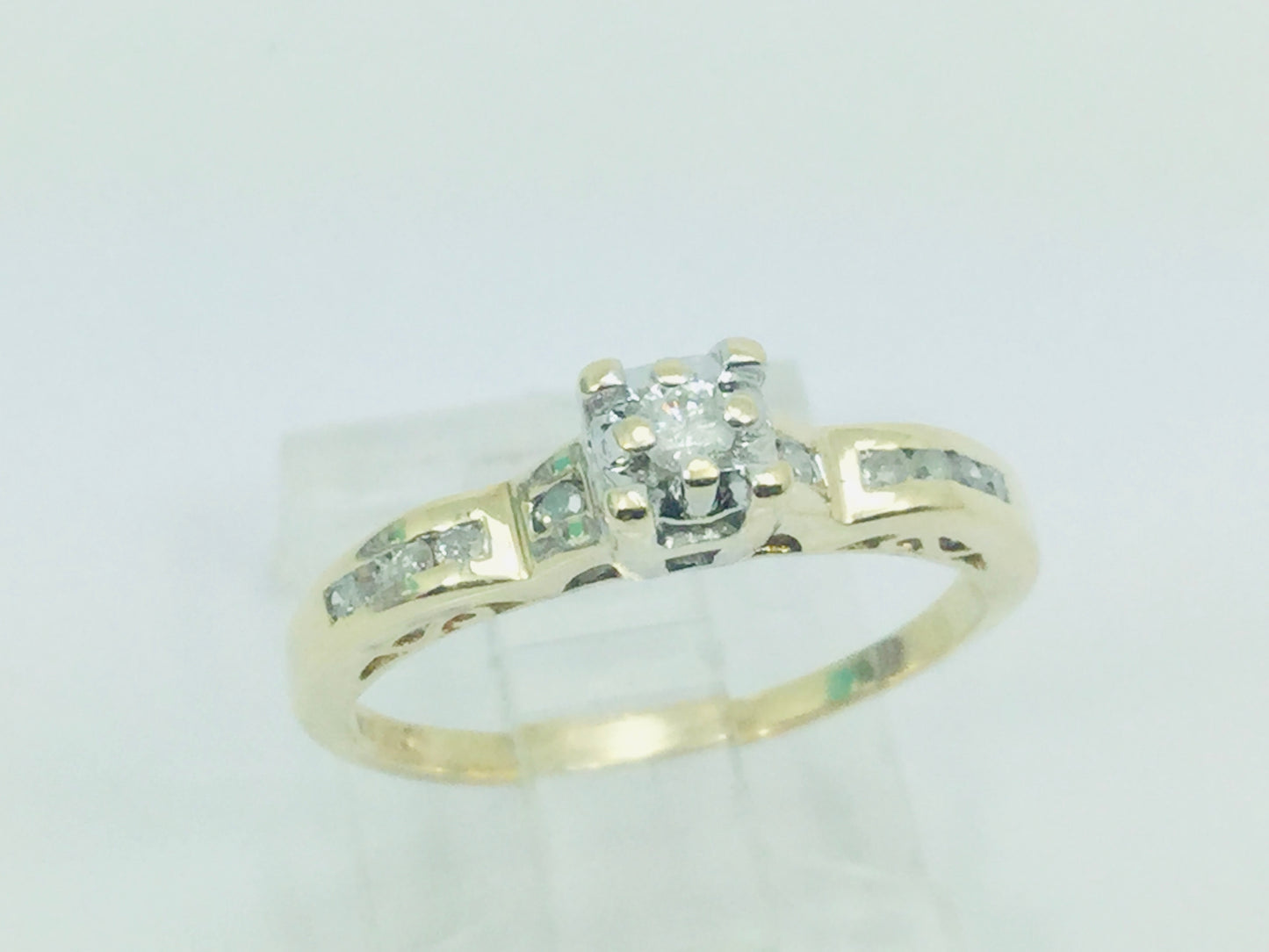 10k Yellow Gold Round Cut 15pt Diamond Illusion Set with Channel Set Accents Ring