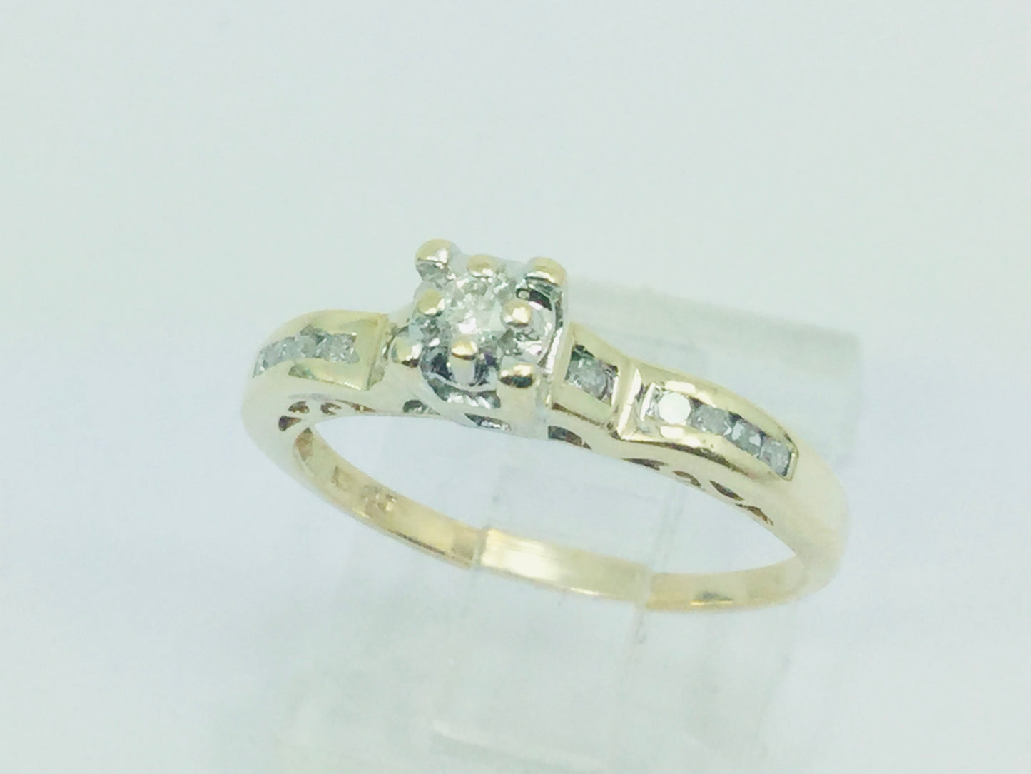 10k Yellow Gold Round Cut 15pt Diamond Illusion Set with Channel Set Accents Ring