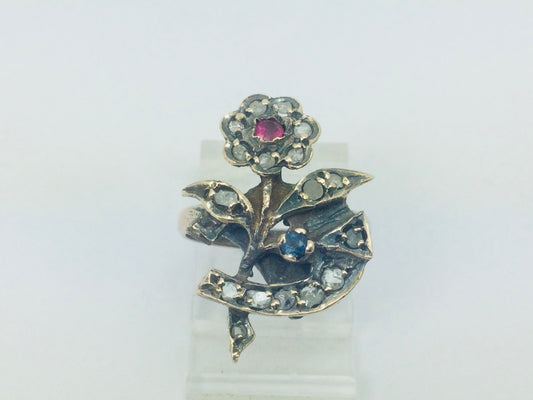 10k Yellow Gold Round Cut 22pt Diamond, 5pt Ruby, and 5pt Blue Topaz Flower Ring